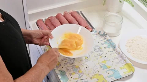 Beating eggs for the preparation of chicken Stock Footage 219674310