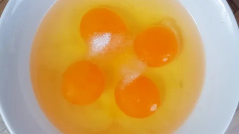 Beating eggs with salt Stock Footage 124109321