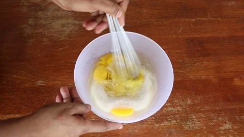 Beating eggs with sugar in a bowl Video stock 75657988