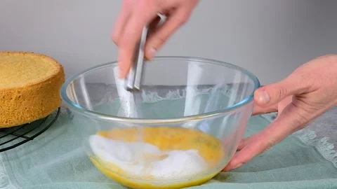 Beating eggs with a whisk. Cooking in home kitchen. Eggs shaking Stock Footage 256655697