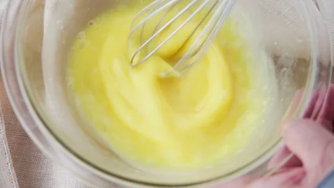 Beating eggs with a whisk Stock Footage 93794191