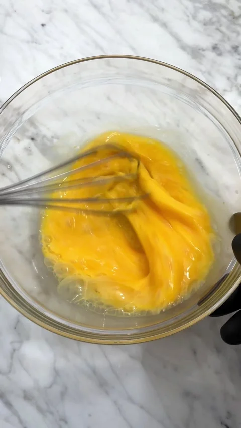 Beating eggs with a wire whisker Stock Footage 286367522