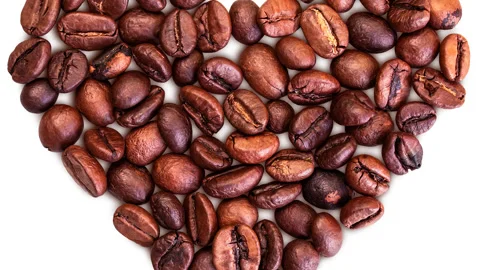 Beating heart shape made of roasted coffee bean. Stock Footage 304622560