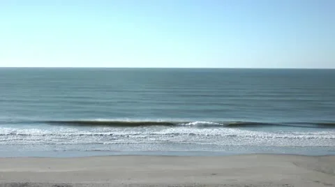 Beating waves on the beach with the calm sea Stock Footage 12653645