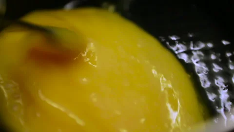 Beating yellow egg yolks and mixing Stock Footage 169800960