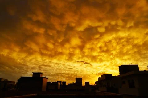 Beauiful view of yellow clouds during sunset in india Stock Photos