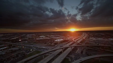 Beauitful stormy Sunset Dronelapse Hyperlapse over busy highway interstate. Video stock 102145646