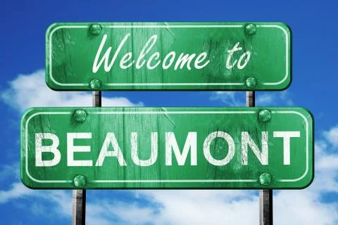 Beaumont vintage green road sign with blue sky background