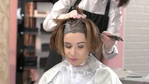 Beautician and client, hair dying. Stock Footage