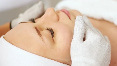 Beautician makes microcurrent procedure on face Stock Footage 214040322