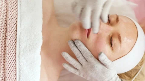 Beautician makes microcurrent procedure on face Stock Footage 214040969