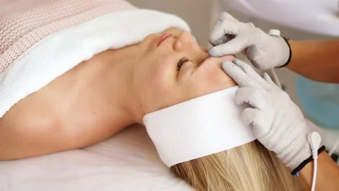Beautician makes a procedure on the face with microcurrent Stock Footage 205316429