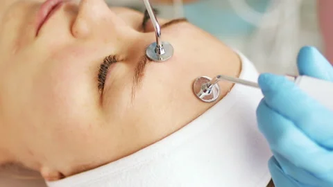 Beautician makes a procedure on the face with microcurrent Stock Footage 205317541