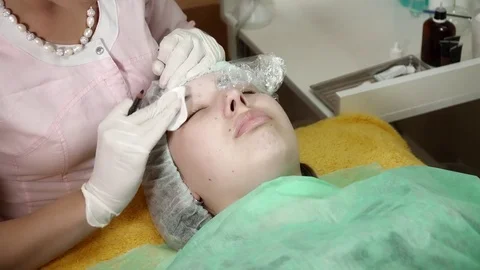 Beautician is making a microblading brocedure Stock Footage