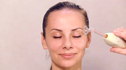 Beautician performs a procedure on the face of the young beautiful girl. Stock Footage 43102367