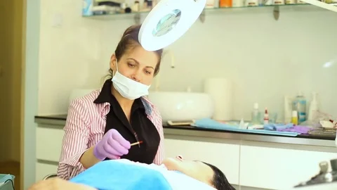 Beautician preparing herself to do a permanent make-up to a client  Video stock 76029678