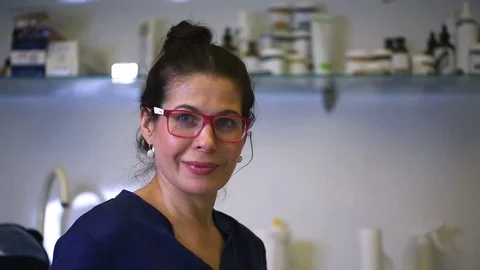 Beautician smile while speaking to the camera in her studio Stock Footage 84860128