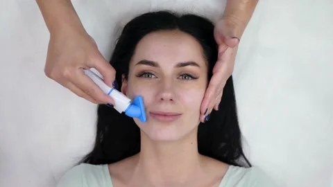 Beautician washes face Stock Footage 147328615