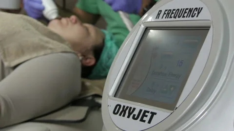 Beautician working with professional device for facial cleansing in beauty salon Stock Footage 59666023