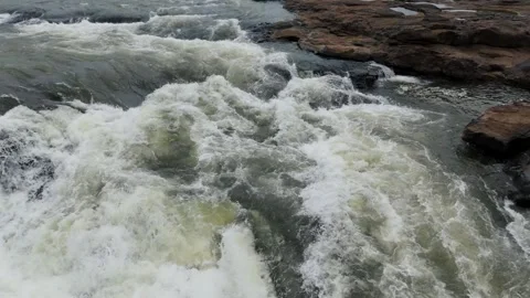 Beautiful 4k aerial drone view of river water flowing in forest Video stock 285387140