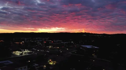 Beautiful 4K arial drone shot of pink clouds in California at sunset Stock Footage
