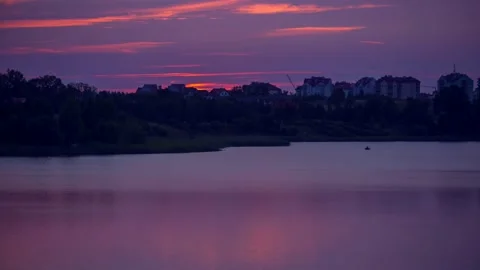 Beautiful 4k time lapse with sunset over small lake near city. Stock Footage 154367695