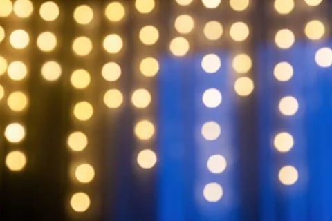 Beautiful abstract bokeh effect with warm gold and cool blue tones Stock Photos