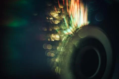 Beautiful abstract cd dvd disk  with multi colored shine light background. Stock Photos