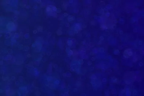 Beautiful abstract deep blue background with hexagon shaped bokeh patten. Фото