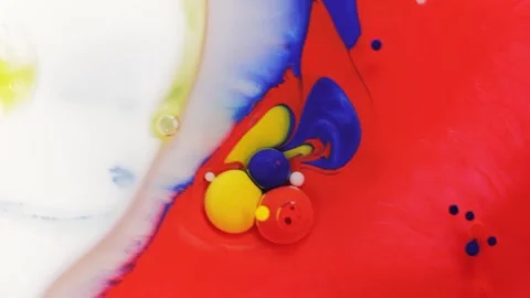 Beautiful abstract paint drops mixed with milk oil and soap Stock Footage 134704664