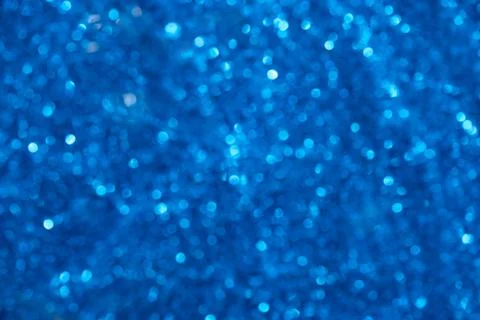 Beautiful abstract pattern with blue festive bokeh. Bright blurred background Stock Photos