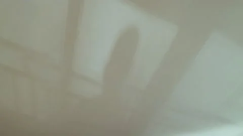 Beautiful abstract shadows on the ceiling and walls. Trembling shadows of the Stockbeeldmateriaal 154458640