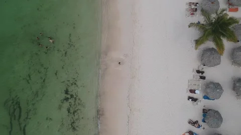 Beautiful aerial panning down view over crystalline waters of Punta Cana beac Stock Footage 158170063