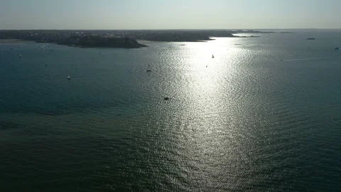 Beautiful aerial push forward shot of the ocean on a hot summer day Stock Footage 119971544