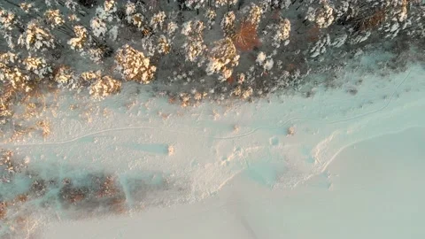 Beautiful aerial rotating top-down view of snow covered forests aroung Gela lake 스톡 동영상 166181390