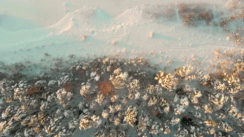 Beautiful aerial rotating top-down view of snow covered forests aroung Gela lake 스톡 동영상 197776158