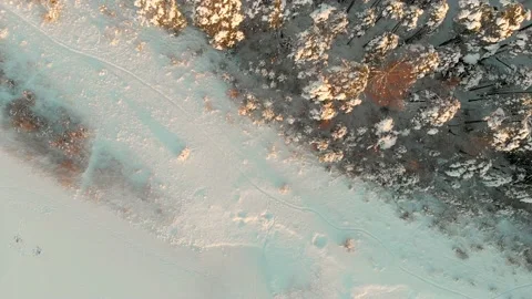 Beautiful aerial rotating top-down view of snow covered forests aroung Gela lake 스톡 동영상 202087716