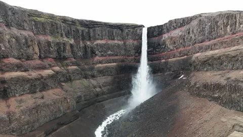 Beautiful aerial shot (drone pullback) of iconic Hengifoss waterfall, Iceland Stock Footage 279663938