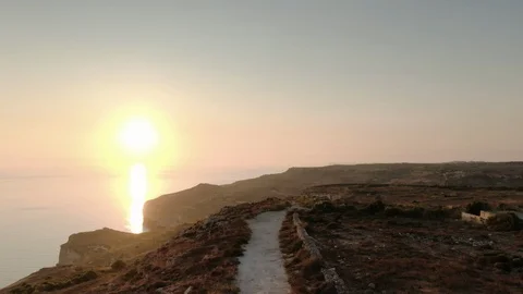 Beautiful Aerial Shot over a path while sunset Stock Footage 113050743