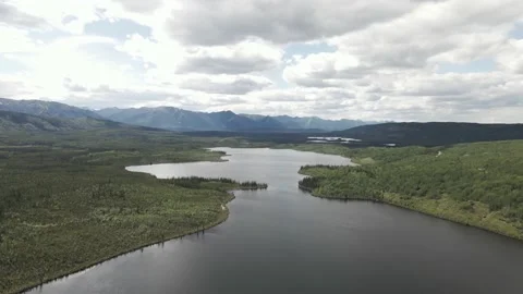 Beautiful aerial side to side view of a large lake in northern Canada Stock Footage 137867424