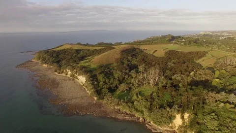 Beautiful aerial sunset view, New Zealand beach at Whangaparaoa, Auckland Stock Footage 101682406