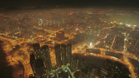 Beautiful aerial time-lapse of massive high-tech city at night Stock Footage 57111455