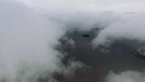 Beautiful aerial view of cloudy landscape and an island in the Lake Stock Footage 80374741