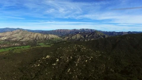 Beautiful aerial view of deep woods and mountains in the distance Stock Footage 80978464