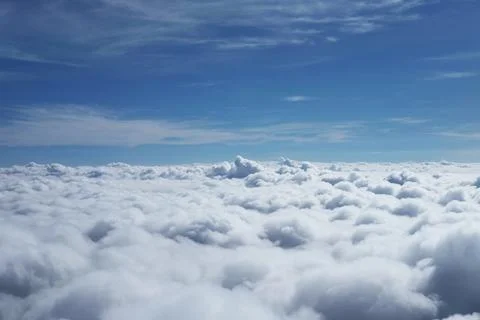 Beautiful Aerial view fluffy cloud and sky from window of airplane Фото