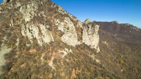 Beautiful aerial view of a mountain range with picturesque rocks. Stock Footage 263317709