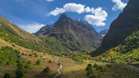 Beautiful aerial view of a mountain range with picturesque peaks. Stock Footage 263363312