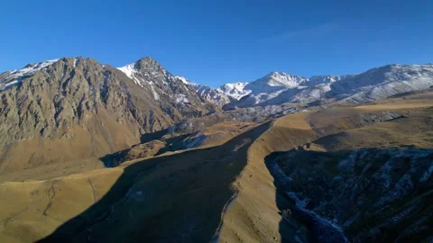 Beautiful aerial view of a mountain range with picturesque peaks. Stock Footage 263593237