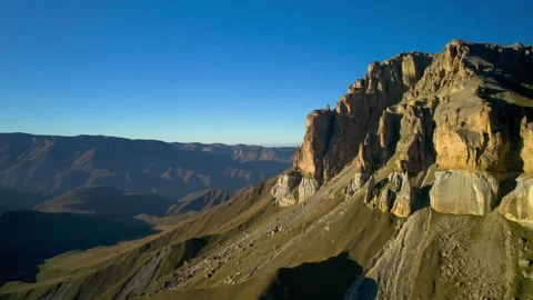 Beautiful aerial view of a mountain range with high cliffs. Stock Footage 293946761