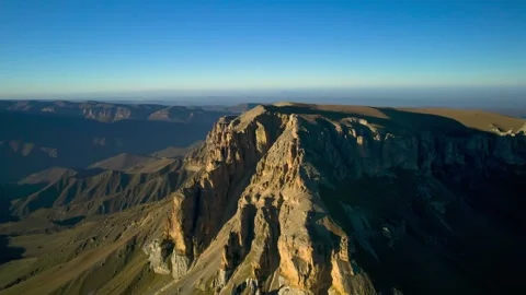 Beautiful aerial view of a mountain range with high cliffs. Stock Footage 293946996